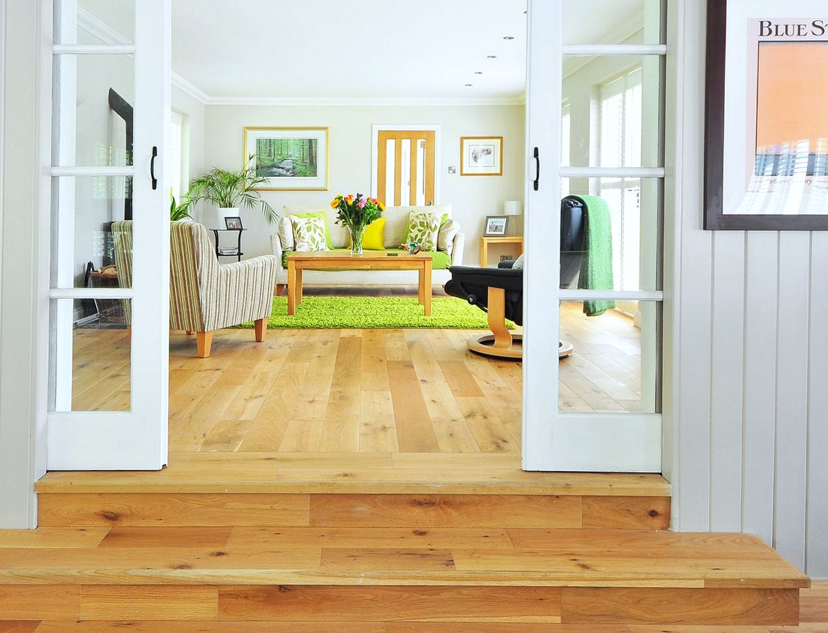 Oak wood flooring running through a hallway into a living room